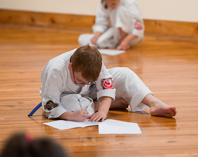 Karate student demonstrating a technique during the exam