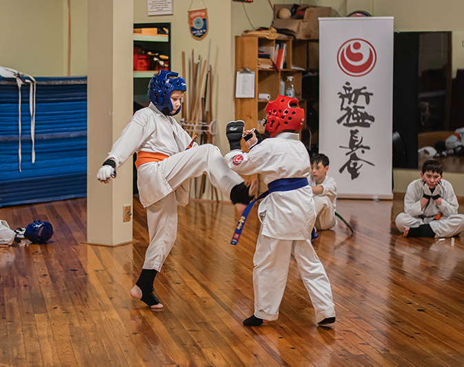 Karate participant moving through an exam exercise